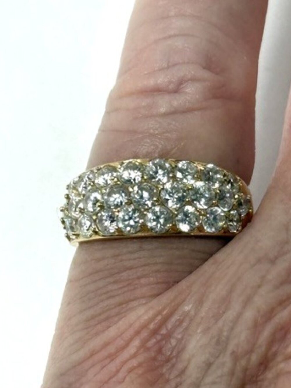 Goid-tone synthetic pave diamond cocktail ring.